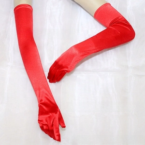 Macro detail of long red satin gloves showing silky texture for formal cosplay party