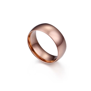 Minimalist 8mm rose gold stainless steel ring with a smooth polished domed finish