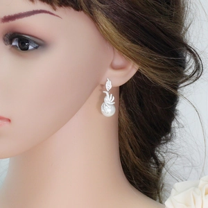 Elegant long silver tassel earrings with white pearls and sparkling cubic zirconia dangles