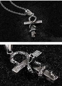 Macro detail of gothic snake wrapped around ankh cross pendant with aged steel finish