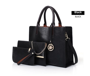 Three-piece black tote bag set with textured PU leather and maple leaf metal charm