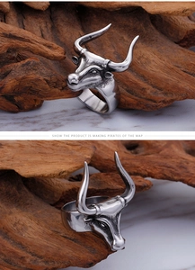 Close-up of vintage silver bull head ring with 3D embossed bull horns in punk style