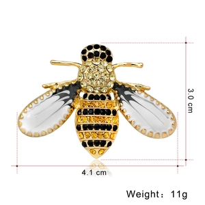 Cute bee brooch pin with yellow rhinestones and white enamel details, size 4.1 x 3.0 cm