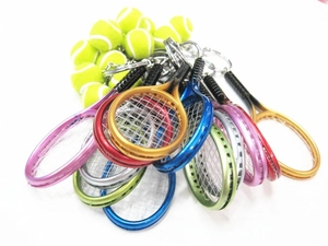 Macro view showing a variety of colorful mini tennis racket and ball keychain pendants