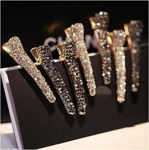 Detailed macro of sparkling rhinestone hair clips in silver and charcoal grey set