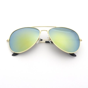 Classic aviator sunglasses with gold metal frame and yellow-green gradient lenses