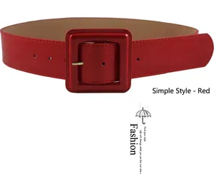 Detailed close-up of a wide red faux leather belt featuring a large square buckle
