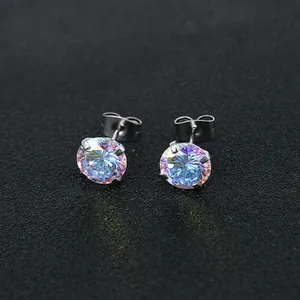 Close-up of rainbow zircon stud earrings with silver four-prong setting and butterfly backs