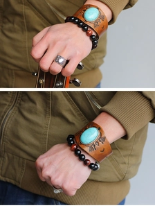 Close-up of bohemian leather bracelet with turquoise and beaded natural stone jewelry