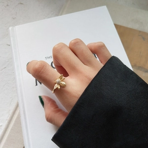 Detail of a 925 sterling silver bee ring with crystal paving on a minimalist band