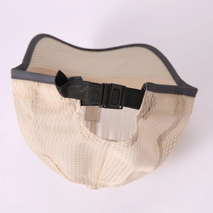 Detail of adjustable black strap and buckle on beige mesh baseball cap back view