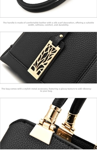 Detail of black lychee grain leather handbag with gold metal hardware and leaf pendant