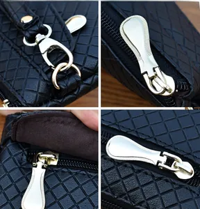 Detail view of black quilted faux leather bag with golden hardware and zipper close-up