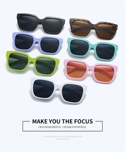 Macro shot of stylish square sunglasses in seven vibrant colors on a light gray background