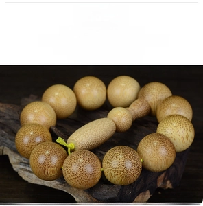 Macro detail of high-density dragon blood bamboo beads with natural golden silk texture