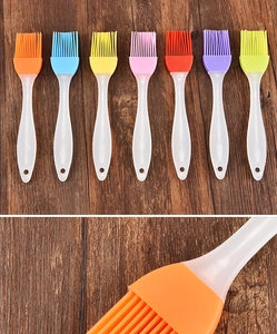 Macro shot of colorful silicone bristles and semi-transparent PP handles of BBQ oil brushes