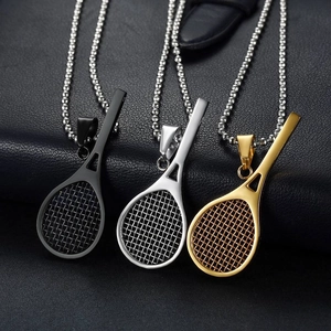 Tennis racket pendant necklaces in black, gold, and silver finishes on leather background