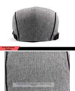 Close-up of grey cotton ivy cap showing textured fabric and black adjustable side buckle