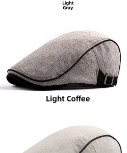 Detail view of light gray and light coffee cotton berets with side metal buckles