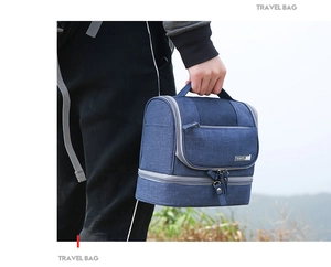 Close-up of durable navy travel bag with dual zipper compartments and fabric texture