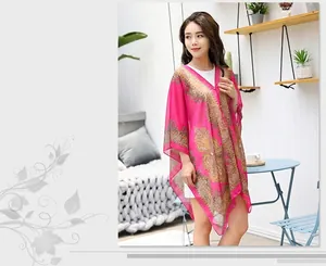 Detail of fuchsia paisley chiffon sun protection shawl with elegant floral pattern