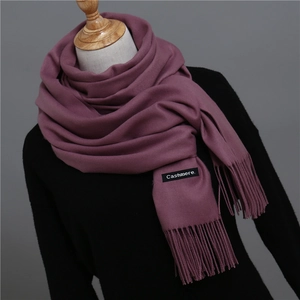 Detail of mauve cashmere scarf showing the soft texture and Cashmere brand label