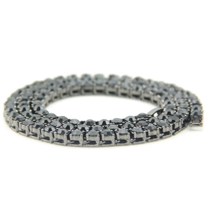 Detailed macro view of 5mm black hip hop tennis necklace with single row stones