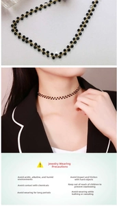 Detail of a black bead choker necklace with gold links on model and flat lay view
