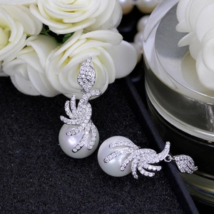 Elegant long pearl earrings with sparkling cubic zirconia in silver-tone metal finish