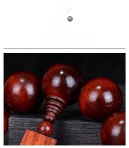 Detailed macro shot of fine wood grain on high-density red sandalwood prayer beads