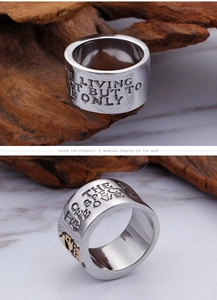 Macro detail of vintage pirate skull ring with gold accents and engraved lettering