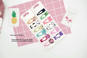 Detailed view of children animal print hair clips with 5cm size measurements