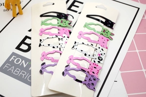 Close-up of colorful cartoon animal hair clips set featuring cats and rabbits for girls