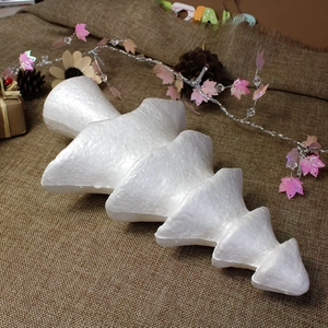 Detailed close-up of a white styrofoam Christmas tree mold for DIY craft decorations