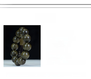 Detailed macro view of 2.0cm Phoebe zhennan beads with natural golden wood grain