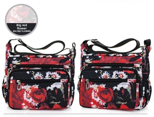 Detail of red floral nylon crossbody bags featuring multi-zipper layers and adjustable straps