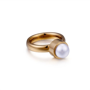 Minimalist gold titanium steel ring featuring a round white freshwater pearl on white background