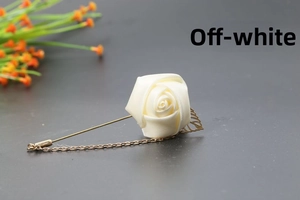 Detailed cream white silk rose lapel pin with golden leaf accents and fine chain pendant