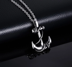 Vintage silver anchor pendant necklace in stainless steel on black leather background