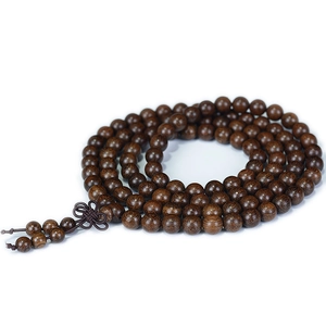 Polished dark brown sandalwood 108 beads prayer bracelet with traditional knot and tassels