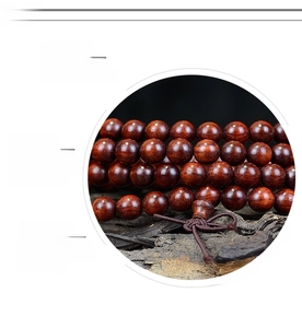 Detail of high-density sandalwood beads with polished texture and natural wood grain