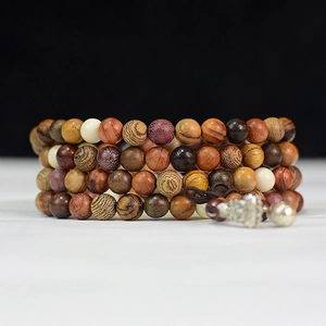 Handcrafted multi-wood 108 mala beads bracelet with deep brown tones and silver pendant