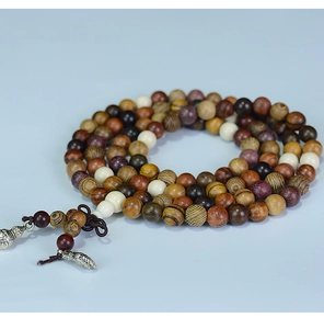 Macro detail of multicolored 108 wood prayer beads with natural grain and ivory nut spacers