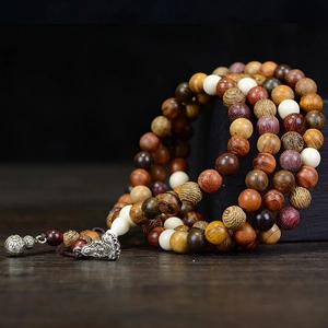 108 Multi-wood beads prayer bracelet with a metal Buddha pendant and small bell