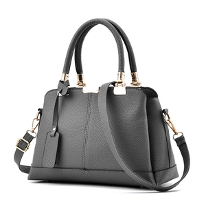 Dark grey pebble leather handbag for women with gold hardware and shoulder strap