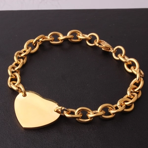 Golden stainless steel cable chain bracelet featuring a large polished heart charm for women
