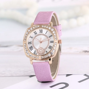 Detail of pink leather watch with rose gold rhinestone bezel and Roman numerals