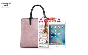 Pink tote bag showing spacious capacity compared with an AMICA magazine and tablet