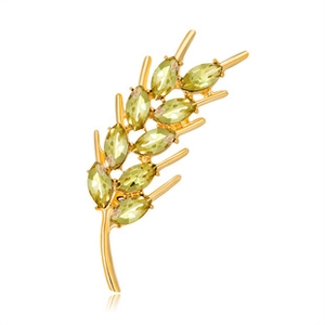 Detail of a golden wheat stalk brooch set with olive green marquise zircon stones