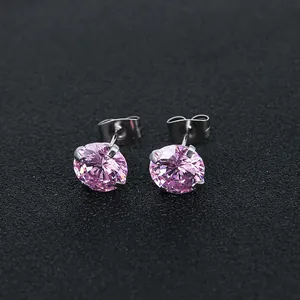 Detail view of pink round zircon stud earrings with classic four-prong setting